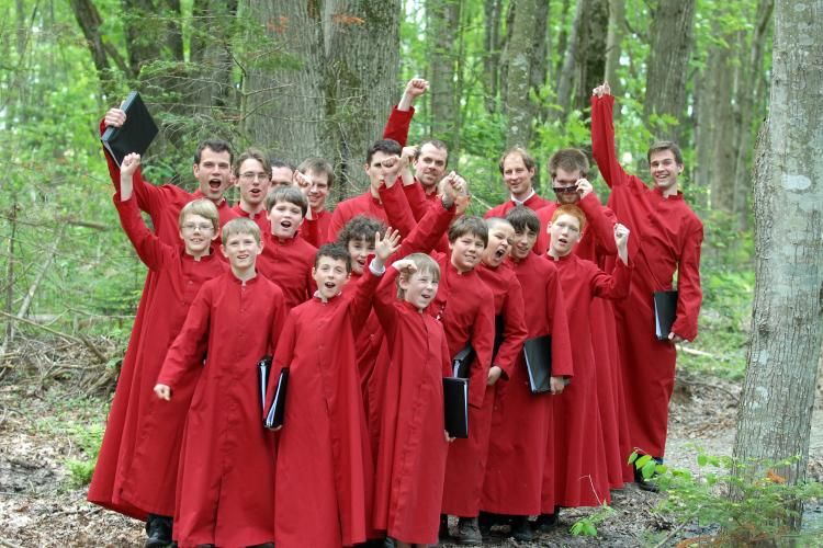 Group shot in the woods with red robes.