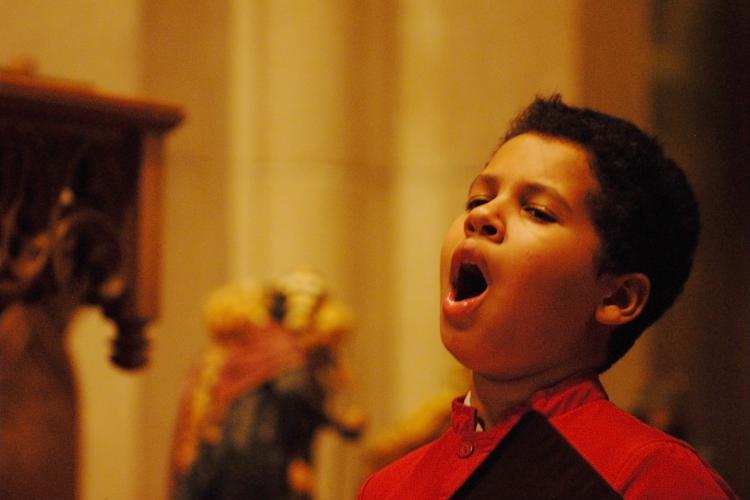 Boy approximately age 11 singing whole-heartedly