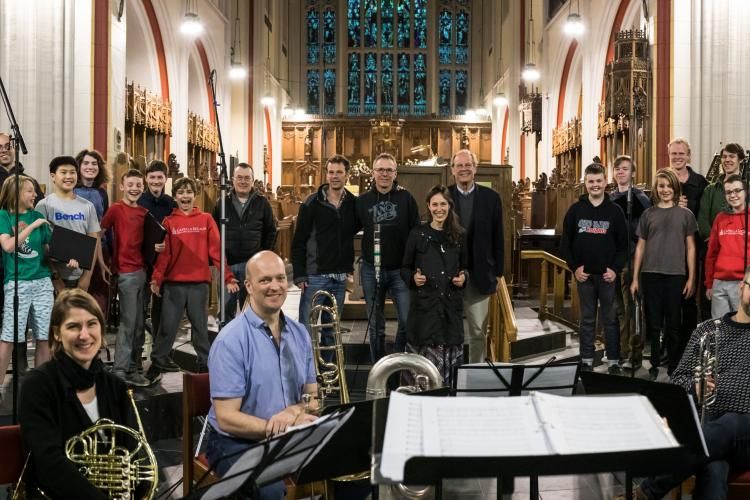 Group photo of men and boys, directors, and Maritime Brass at end of recording session
