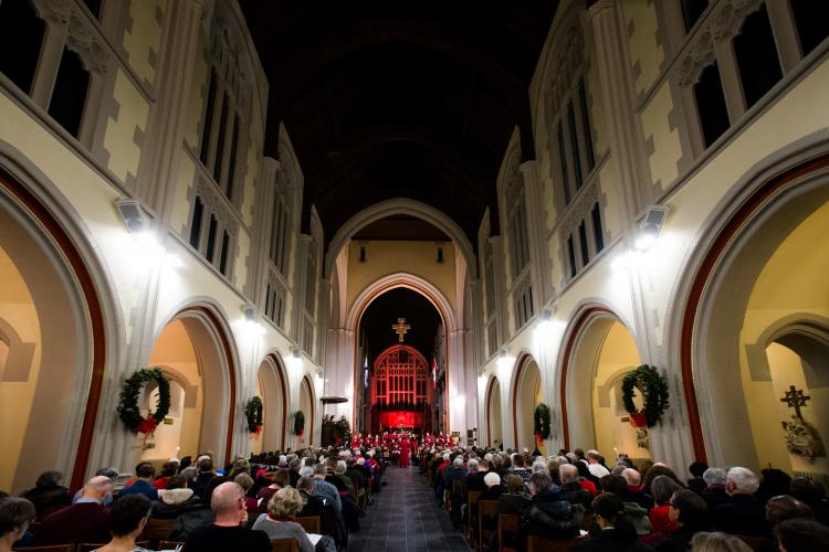 Photo of large audience at Christmas concert in Cathedral with choir far up at front