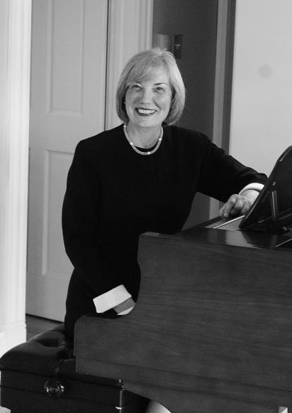 Barbara Butler sitting at the piano